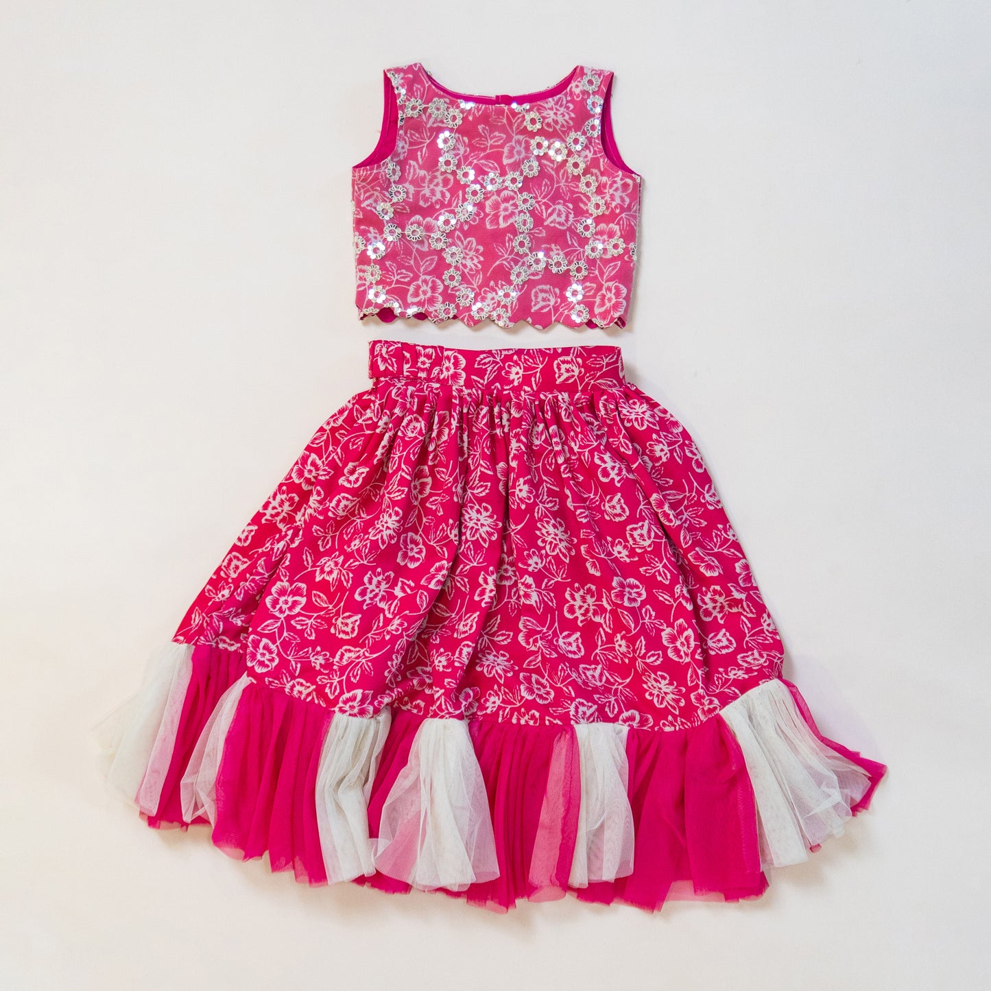 Pre Order: Pink and White Floral Printed Designer Lehenga Choli with scalloped top and frilly Lehenga