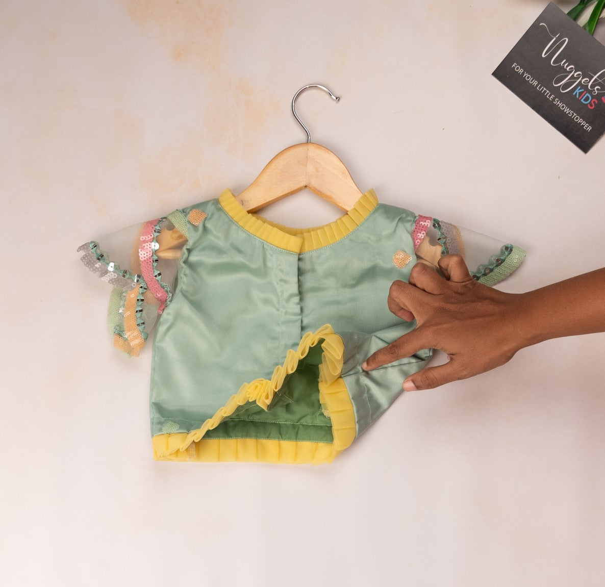 Pre Order: Pastel teal green sequined lehenga with pleated neck top and capelet sleeves