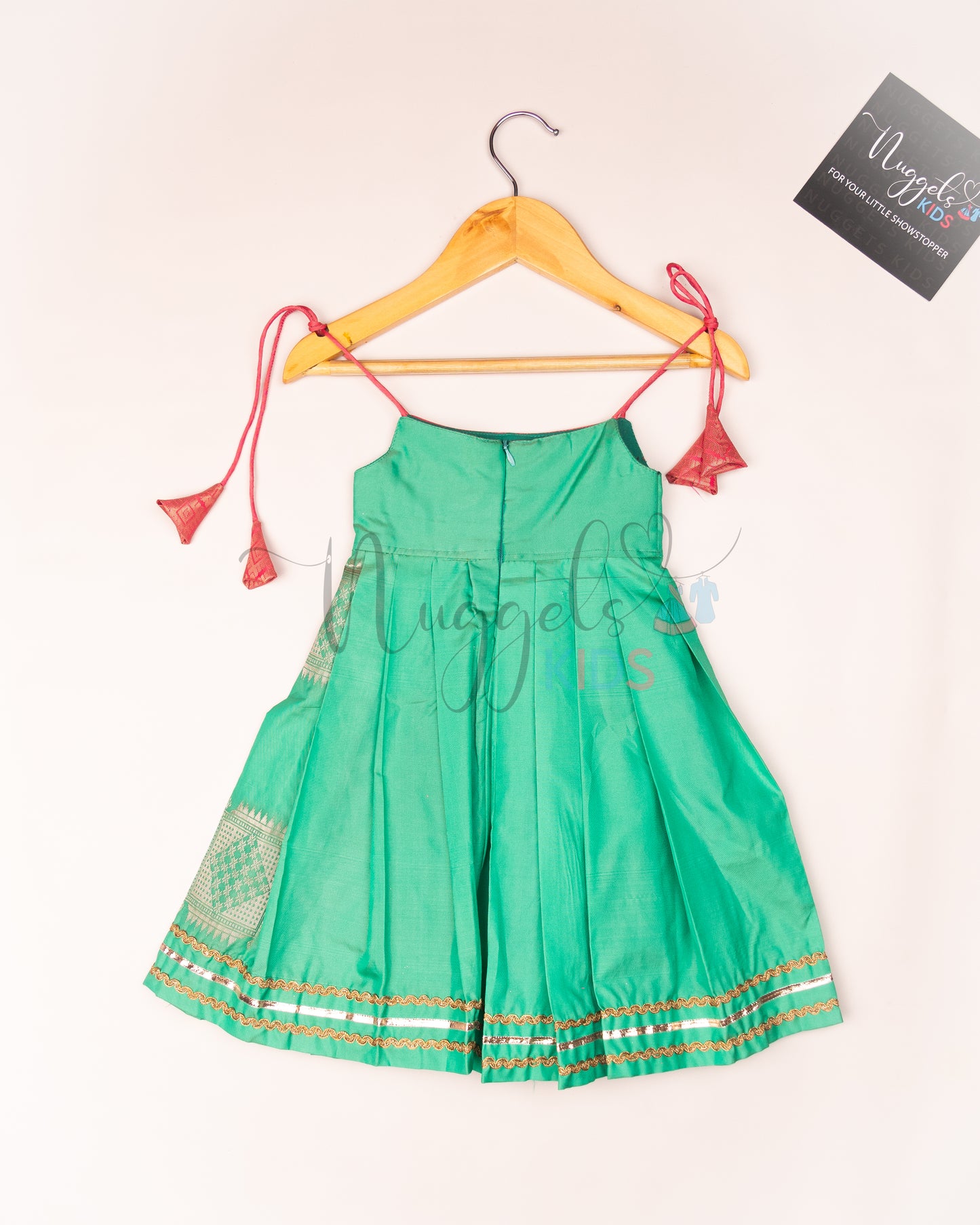 Ready to Ship: Pista Green Semi Silk Tie up frock with patch work yoke, Potli button and lace detailing