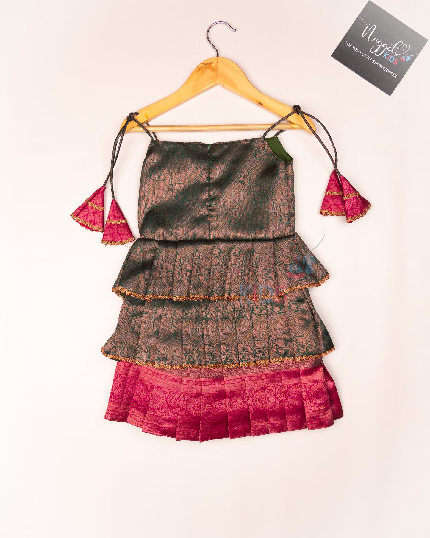 Ready to Ship: Bottle Green Tri layered semi silk newborn tie up frock with all over copper and lavender zari and bow detailing