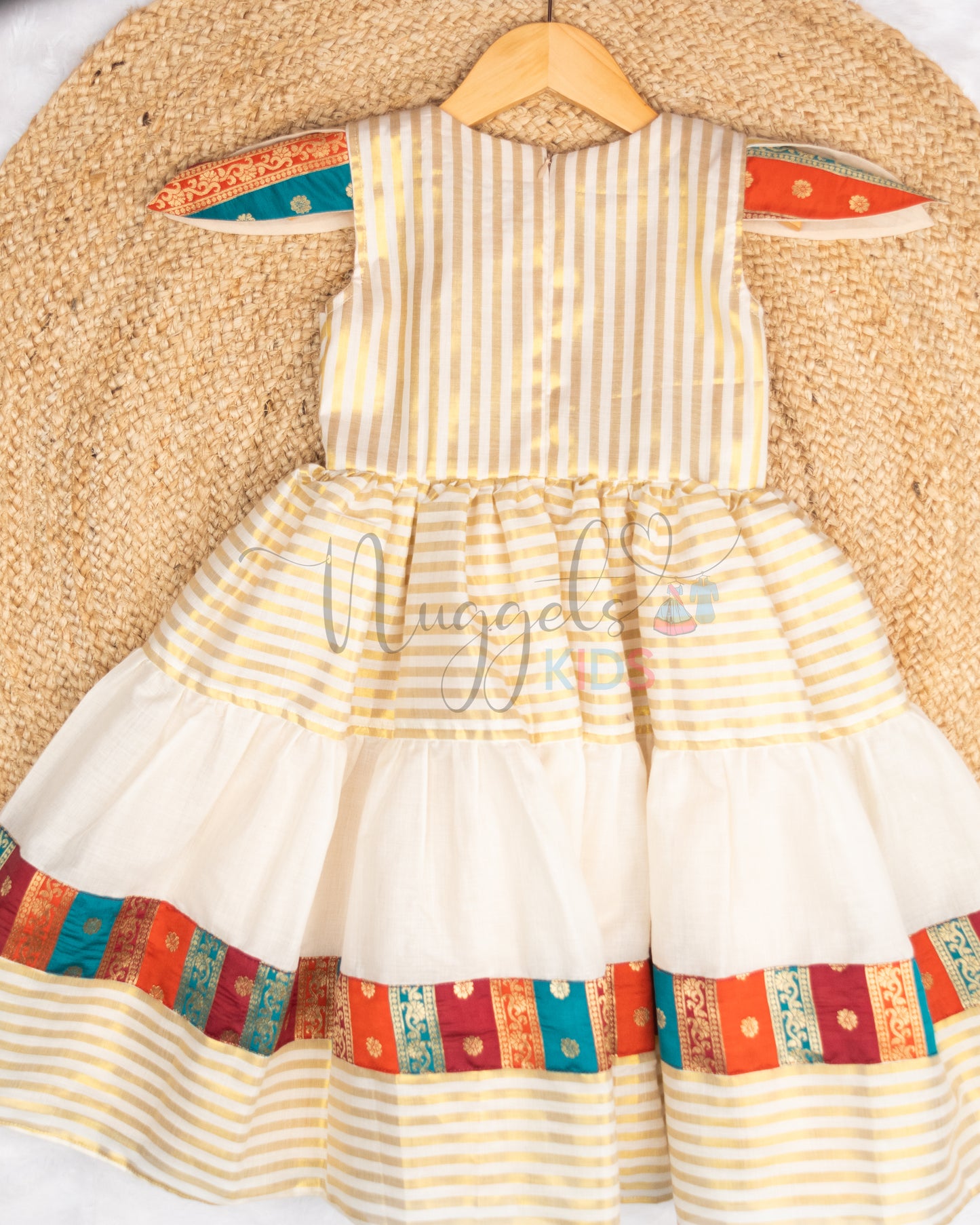 Pre Order: Angrakha style golden kasavu frock with brocade patch, layered flare and tulip sleeves