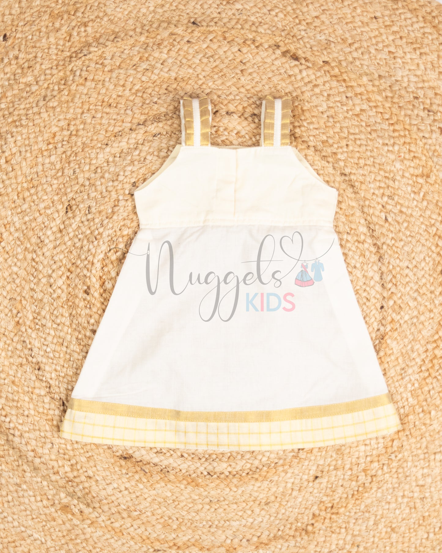 Pre Order: Sleeveless Kasavu A line Frock with pleated strap, bow detailing and check border