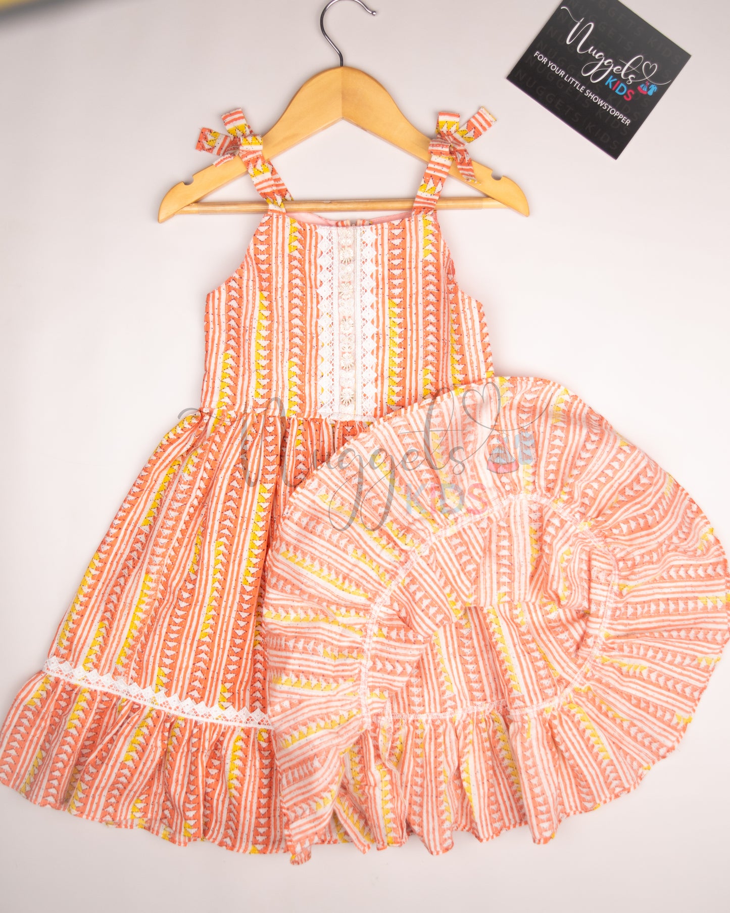 Ready to Ship: Coral Kantha Sleeveless Frock with multilayered lace detailing in the yoke and flare, and attached bows in the shoulder strap