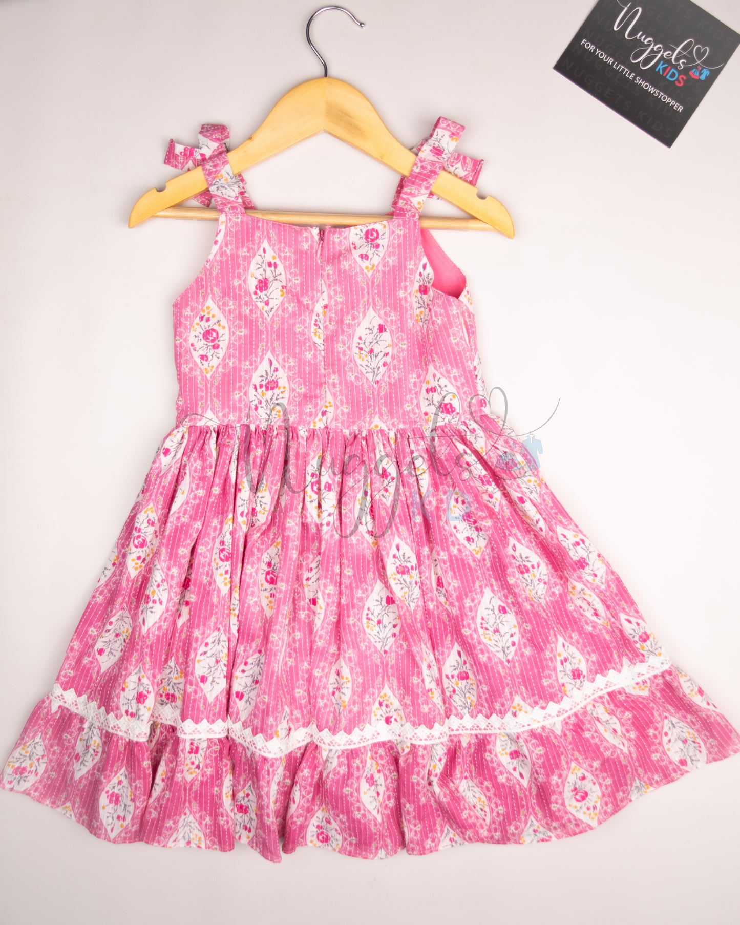 Ready to Ship: Pink Kantha Sleeveless Frock with multilayered lace detailing in the yoke and flare, and attached bows in the shoulder strap