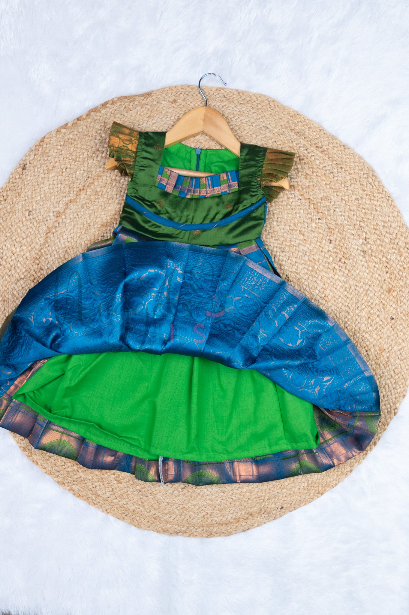 Ready to Ship: Blue and Green Checks Kanchi Meenakari Semi Silk frock with patch work pleated yoke (Green), big zari borders and ruffle sleeves