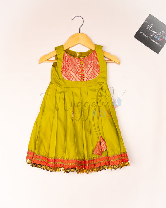 Ready to Ship: Soft Semi Silk Elaichi Green frock with patch work yolk, potli button and patch work hem with lace detailing