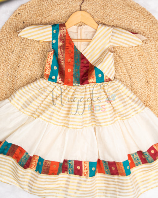 Pre Order: Angrakha style golden kasavu frock with brocade patch, layered flare and tulip sleeves