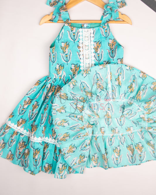 Ready to Ship: Turquoise Blue Kantha Sleeveless Frock with multilayered lace detailing in the yoke and flare, and attached bows in the shoulder strap