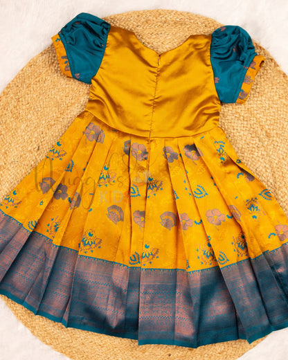 Ready to Ship: Yellow and Peacock Blue Kanchi Meenakari Semi Silk frock with patch work yoke, big zari borders and puff sleeves with pleated ends