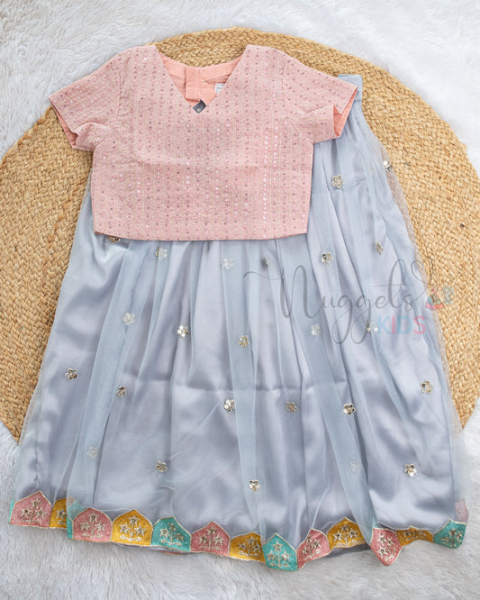 Pre Order: Dusky Pink Top And Ice Blue Lehenga Set