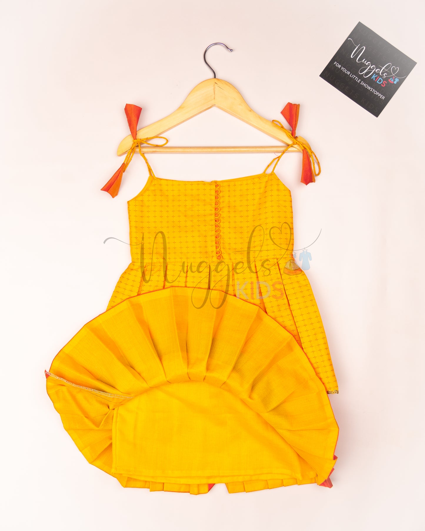 Ready to Ship: Yellow and Peach Two layered semi silk tie-up frock with potli buttons and lace detailing